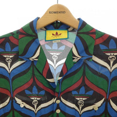 Colorful patterned shirt on a hanger with 'KOMEHYO' branding.
