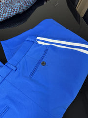 Blue pants with white stripes on a dark surface
