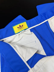 Blue and white jacket with a Gucci label on a black background