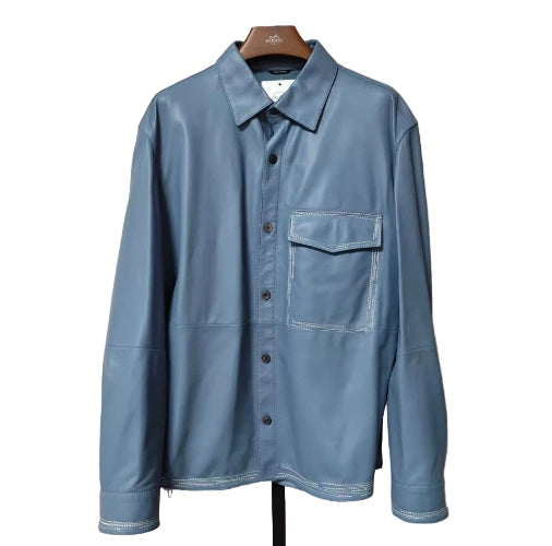 Blue shirt on a hanger against a white background