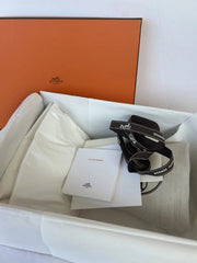 Product in a box with power adapter on a white background