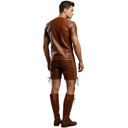 Man wearing a brown leather outfit with decorative elements on a plain background