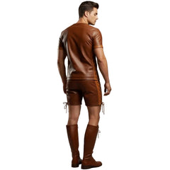 Man wearing a brown leather outfit with decorative elements on a plain background
