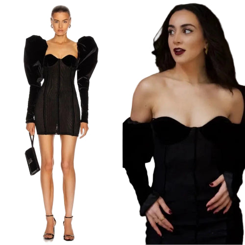 Black dress with puffed sleeves worn by a model on a white background