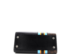 Black clutch bag with colorful stripes on a white background