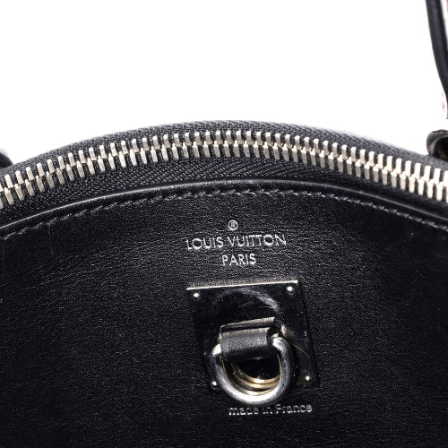 Close-up of a black Louis Vuitton handbag with visible branding.