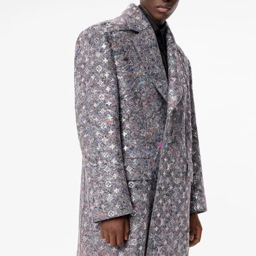 Person wearing a patterned coat on a white background