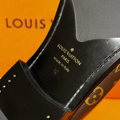 Louis Vuitton shoe with brand name and 'made in Italy' text on an orange background