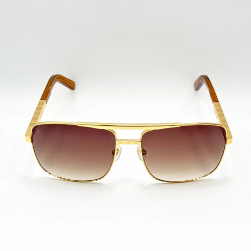 Gold-framed sunglasses with brown gradient lenses on a white background
