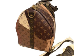 Designer handbag with visible brand logo on a neutral background