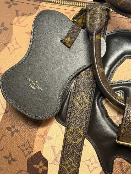 Louis Vuitton leather products on a patterned surface