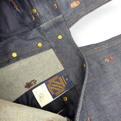 Close-up of a denim jacket with a brand label, showing stitching and material texture.