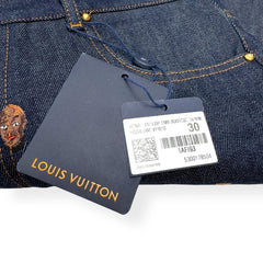 Louis Vuitton denim product with a tag on a white background