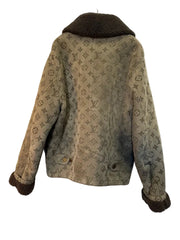 Patterned jacket with fur trim on a white background