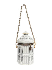 Decorative lantern shaped like a building with a chain on a white background