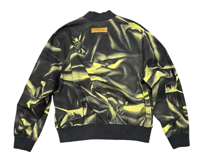 Black and yellow camouflage bomber jacket on a white background