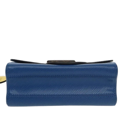 Blue textured wallet with a black strap on a light gray background