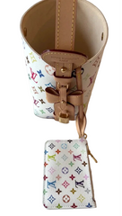 Louis Vuitton monogram handbag and wallet on a white surface