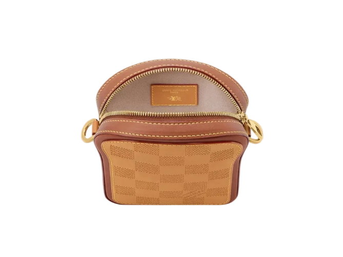 Brown patterned handbag with gold zipper on a white background
