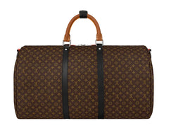 A Louis Vuitton monogram canvas duffel bag with brown leather top handles and black vertical straps, shown against a light gray background.