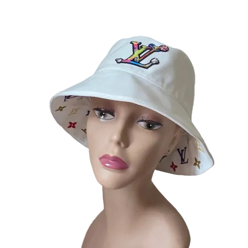 White bucket hat with colorful logo on a mannequin head against a plain background