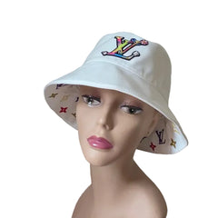 White bucket hat with colorful logo on a mannequin head against a plain background