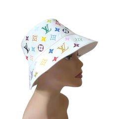 White bucket hat with colorful logos on a mannequin head against a plain background