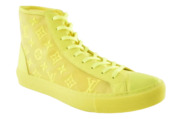A single high-top sneaker in a solid neon yellow color, featuring an embossed Louis Vuitton monogram pattern on the side panels and matching yellow laces, shown against a plain white background.