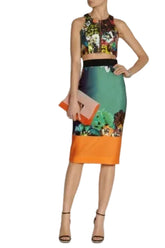 Woman wearing a colorful dress with a floral top and gradient skirt against a white background