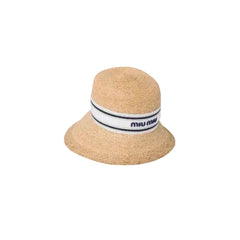 Beige straw hat with a Miu Miu band on a beige background