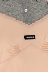 Close-up of a beige garment with a black label featuring the brand 'Miu Miu'.