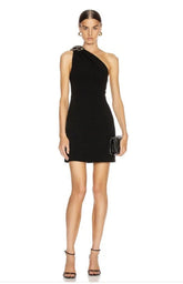 Woman wearing a black one-shoulder dress on a white background