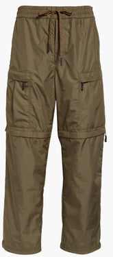 Olive green cargo pants with a drawstring waist and multiple utility pockets, shown against a plain white background.