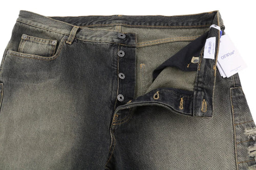 Close-up of a pair of dark green jeans with a tag on a white background