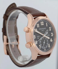 Watch with brown leather strap and rose gold case on a white background