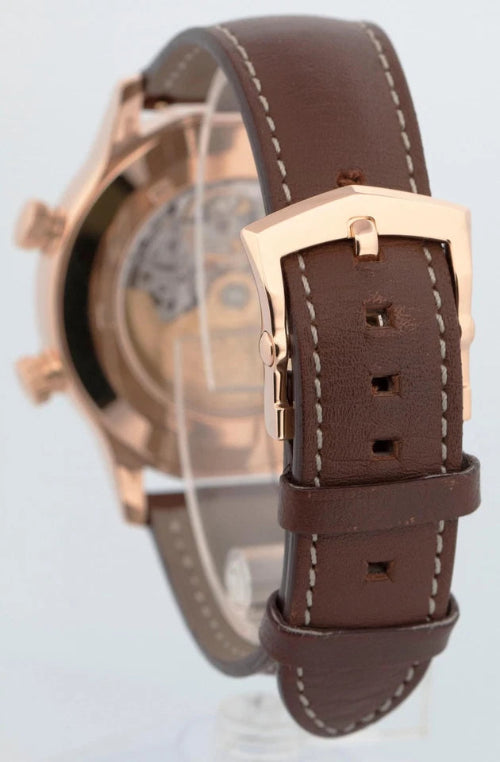 Watch with brown leather strap and rose gold casing on a white background