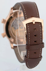 Watch with brown leather strap and rose gold casing on a white background