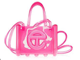 Pink transparent handbag with a logo on a white background