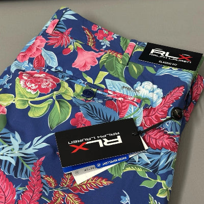 Colorful floral-patterned fabric with a brand label on a white background
