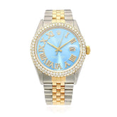 Two-tone watch with a blue face and gold accents on a white background
