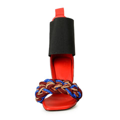 Red sandal with braided strap on a white background