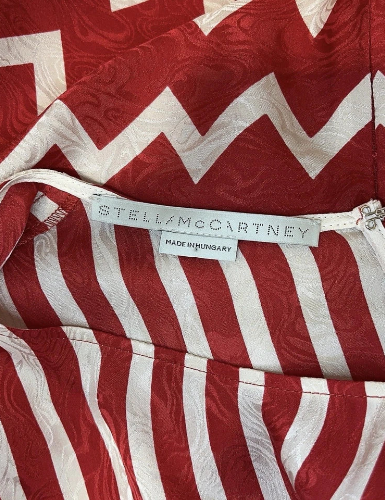 Red and white zigzag patterned fabric with a Stella McCartney label.