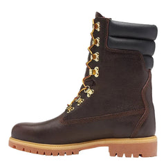 Brown leather boot with gold laces on a white background