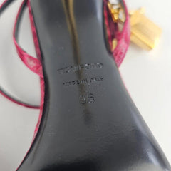Black high-heeled shoe with 'Tom Ford' branding and 'Made in Italy' text on a white background.