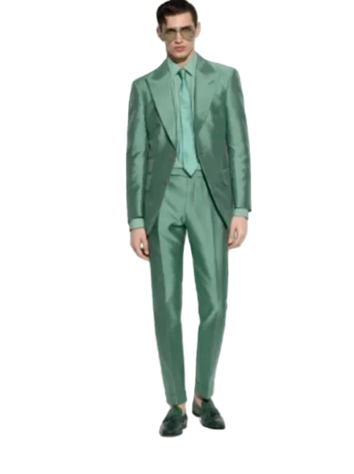 Man wearing a green suit on a white background