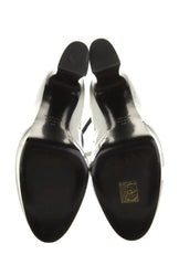 Black dress shoes with a visible brand logo on a white background