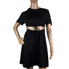 Black dress on a mannequin against a beige background