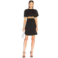 Woman wearing a black outfit on a white background