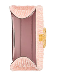 Pink textured clutch with gold clasp on a white background