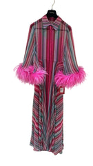A pink and gray striped robe with bright pink faux fur trim on the collar and cuffs, hanging on a black hanger against a white background.